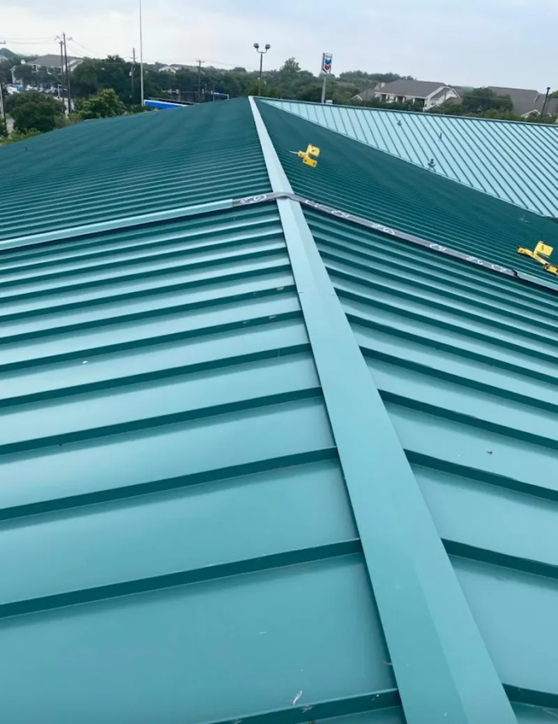 Green commercial metal roof ridge and valley for Metal Roof Repair in The Crossings